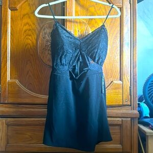 Black leave cut out stomach little black dress.